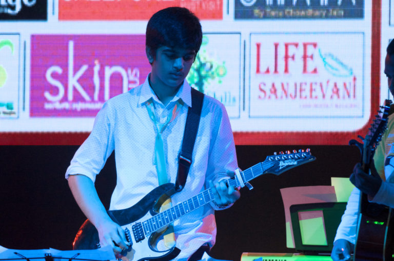 Boy in Spotted Shirt on Guitar